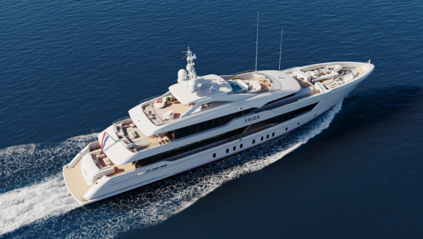 A luxury yacht named 'Frida' cruising on a calm blue sea, featuring multiple decks with seating areas and a small pool.