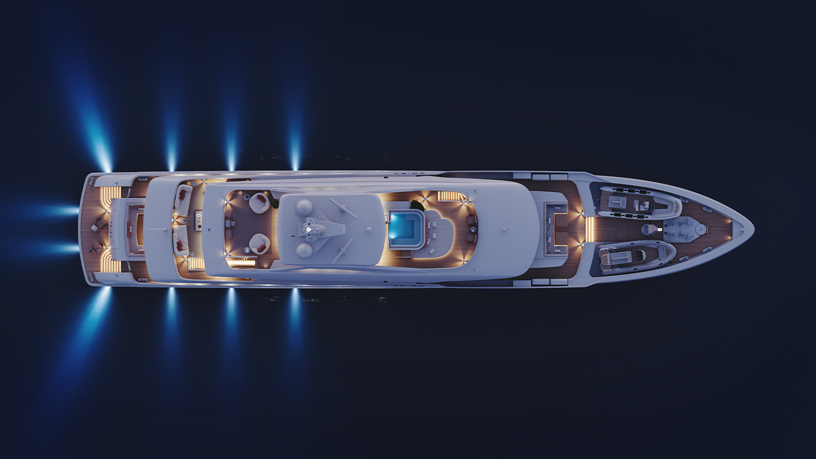 Aerial view of a well-lit yacht at night on dark waters, featuring multiple decks with seating areas, a small pool, and blue lights illuminating the water around it.