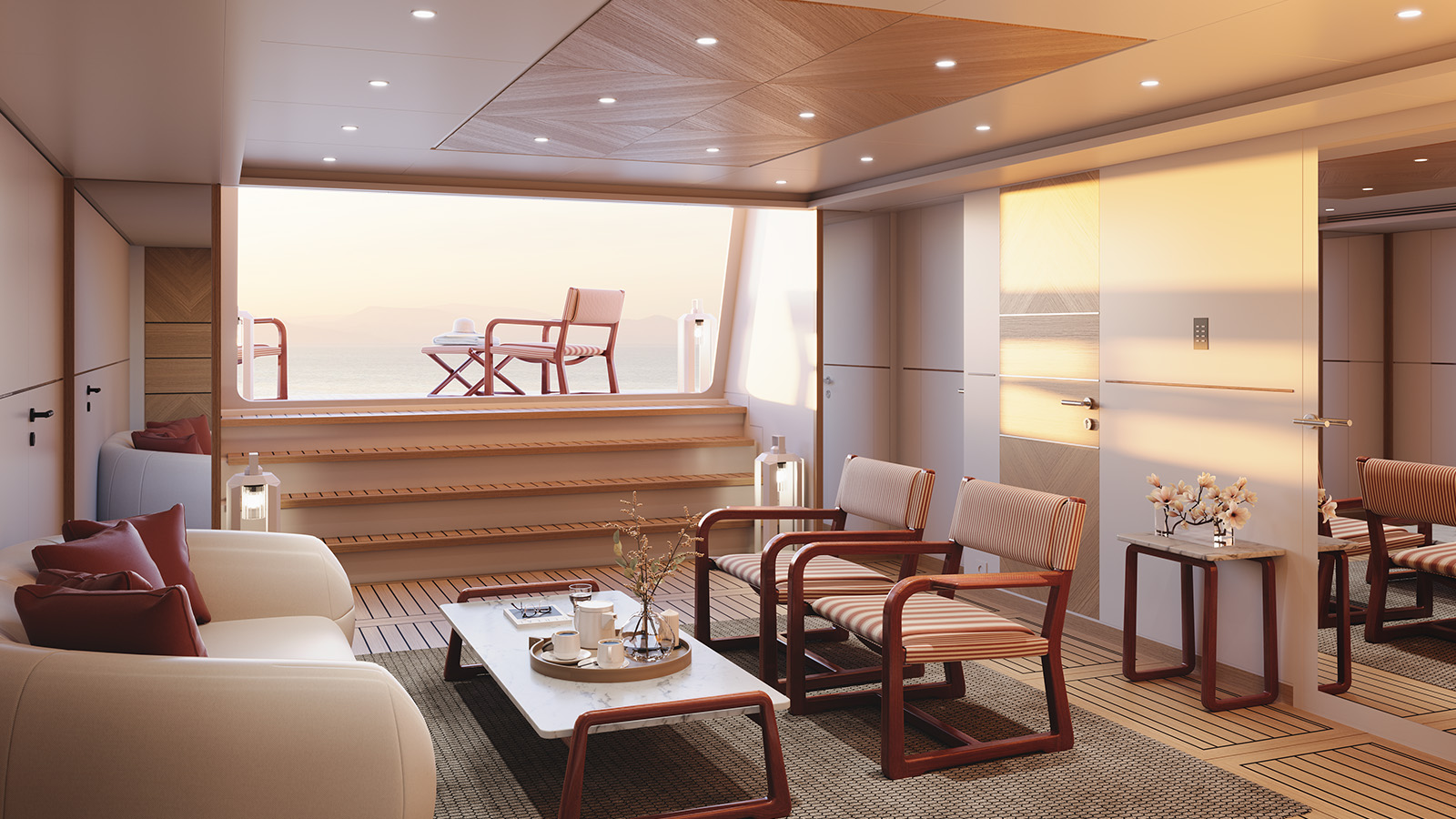 Luxurious boat interior with modern seating, a coffee table, and open doors leading to an outdoor deck with chairs overlooking the sea at sunset.