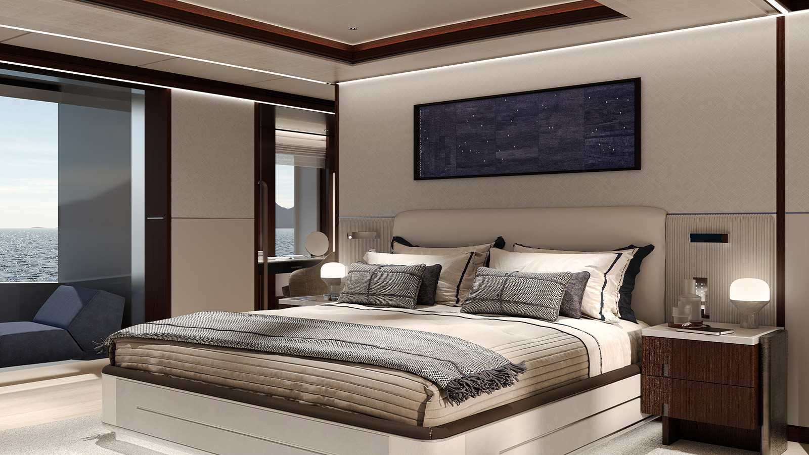 A luxurious bedroom with a large bed covered in beige and gray bedding, a dark wooden nightstand with a lamp beside the bed, and a blue lounge chair near a window overlooking the sea.