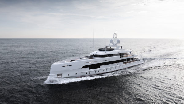 A large white luxury yacht cruising on a calm ocean under a cloudy sky.