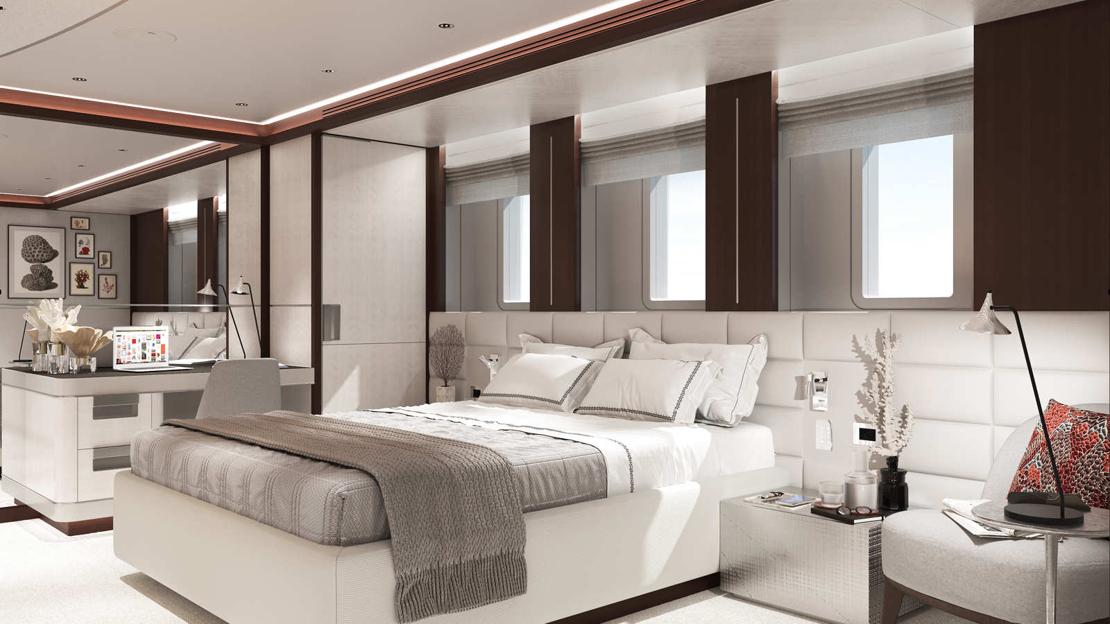 A luxurious bedroom with modern decor featuring a comfortable bed with white and gray bedding, a sleek desk with a laptop, artwork on the walls, and large windows allowing natural light to enter the space.